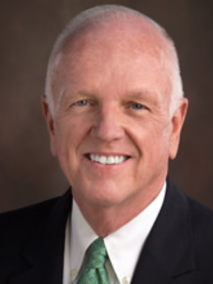 A picture of a gray-haired man in a suit